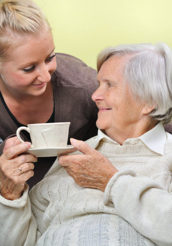 senior woman with caregiver at home