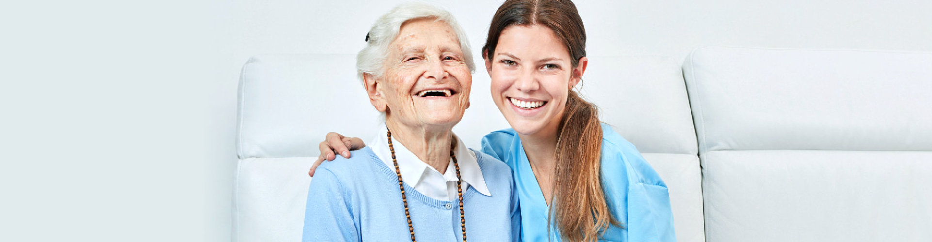 happy senior woman and caregiver