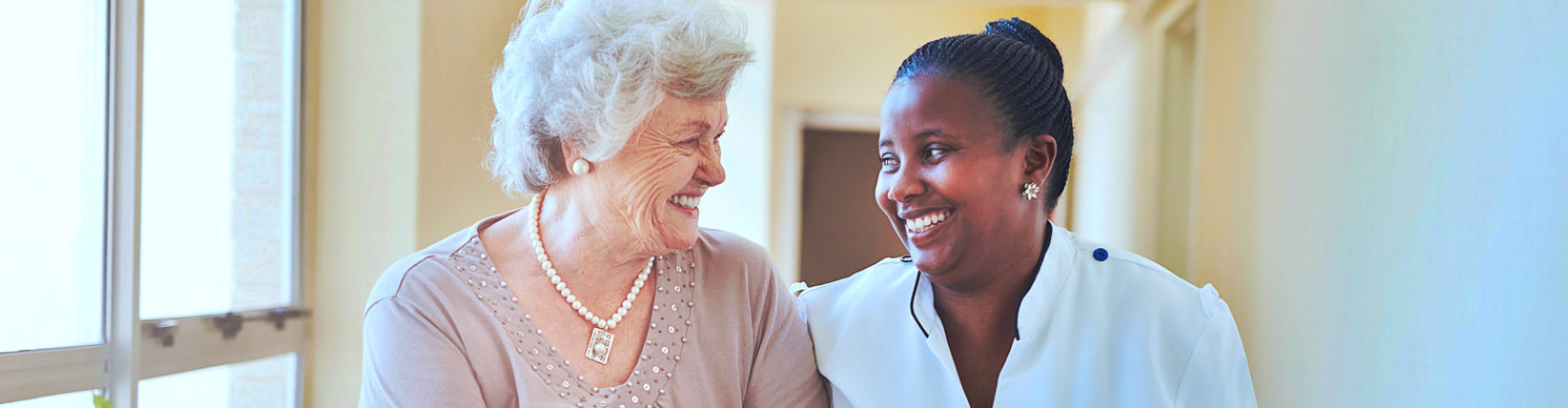 caregiver and senior woman talking